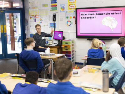 Brad leading a drama workshop in a classroom.