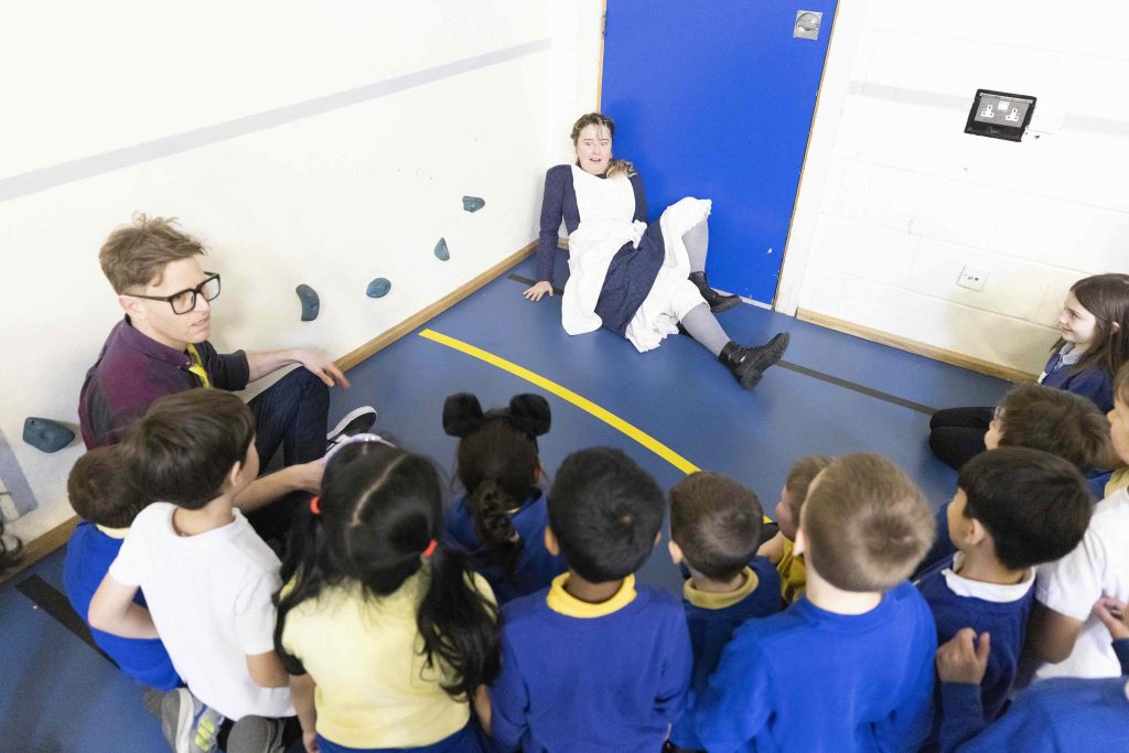 Brad and Jeannie facilitating a project with group of school pupils