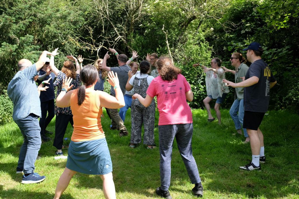 Group of adults taking part in drama activities during workshop