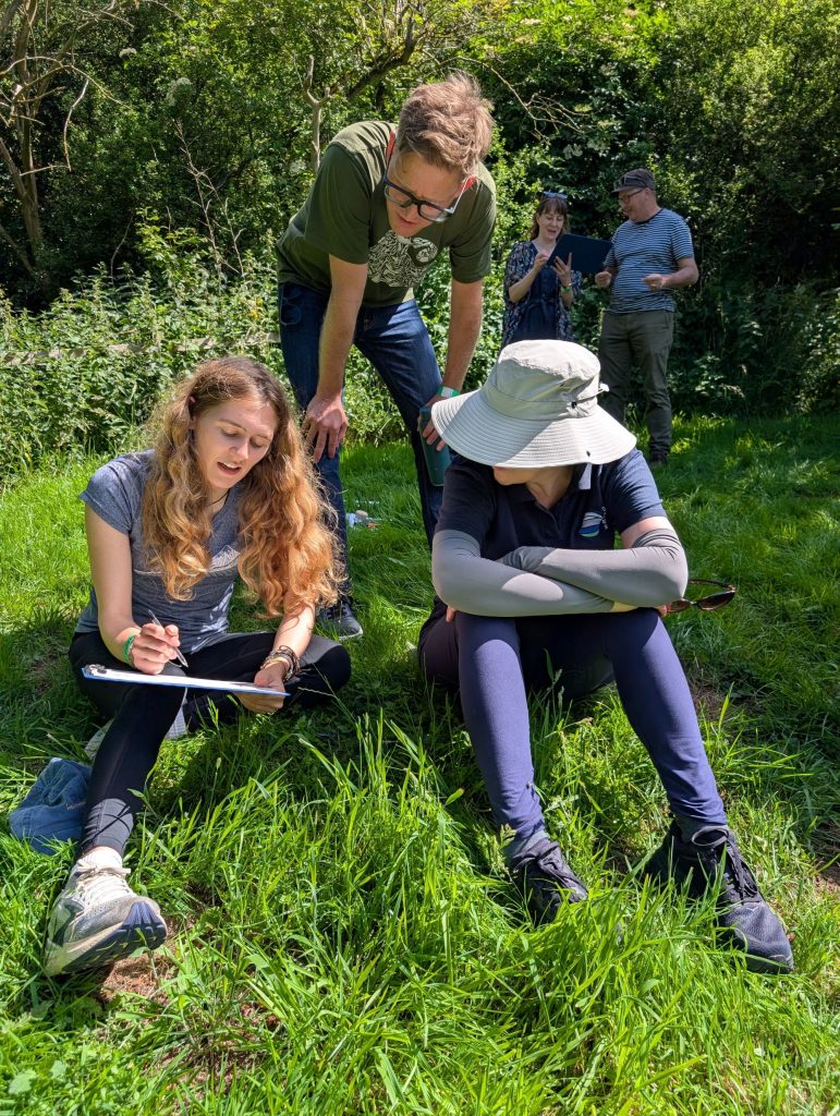 Brad interacting with two pupils taking part in a workshop